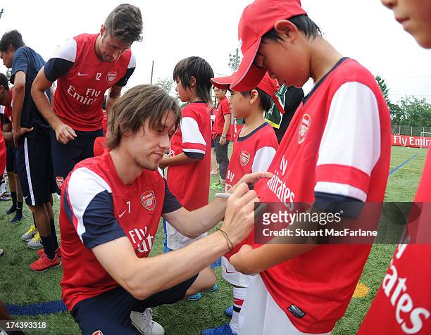 Arsenal's Tomas Rosicky signs autographs as he attends an Emirates Soccer Clinic in Saitama during the club's pre-season Asian tour on July 25, 2013...