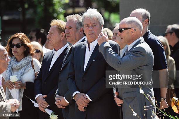 French actor Alain Delon , MoDem centrist party leader Francois Bayrou and French journalist Robert Namias and his wife Anne Barrere attend the...