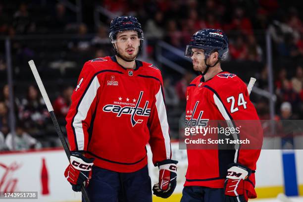 Hardy Haman Aktell and Connor McMichael of the Washington Capitals look on during the first period of the NHL preseason game against the Columbus...