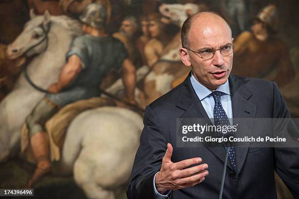 Italian Prime Minister Enrico Letta gestures as he attends a press conference with Secretary General of NATO Anders Fogh Rasmussen at Palazzo Chigi...