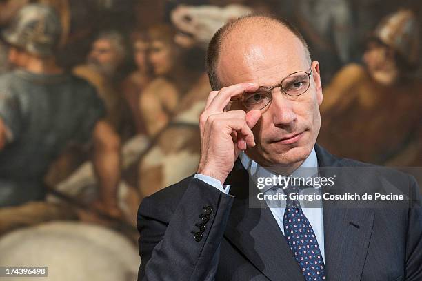 Italian Prime Minister Enrico Letta gestures as he attends a press conference with Secretary General of NATO Anders Fogh Rasmussen at Palazzo Chigi...