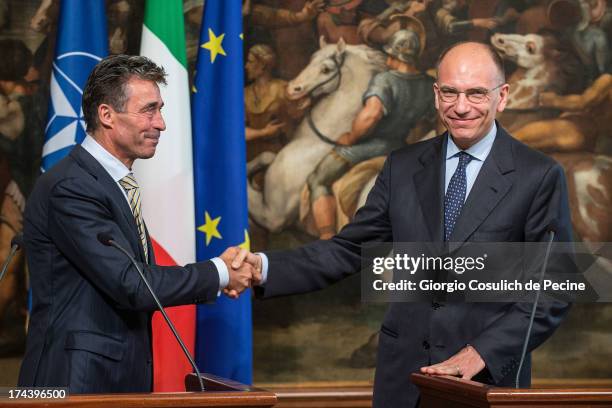 Secretary General of NATO Anders Fogh Rasmussen shakes hands with Italian Prime Minister Enrico Letta after a press conference at Palazzo Chigi on...
