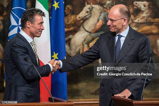 Secretary General of NATO Anders Fogh Rasmussen shakes hand with Italian Prime Minister Enrico Letta, after a press conference at Palazzo Chigi on...