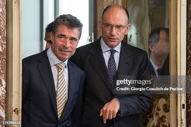 Secretary General of NATO Anders Fogh Rasmussen and Italian Prime Minister Enrico Letta arrive to attend a press conference at Palazzo Chigi on July...