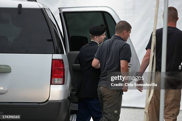 Army Private First Class Bradley Manning is escorted by military police as he arrives for closing arguments in his military trial July 25, 2013 Fort...