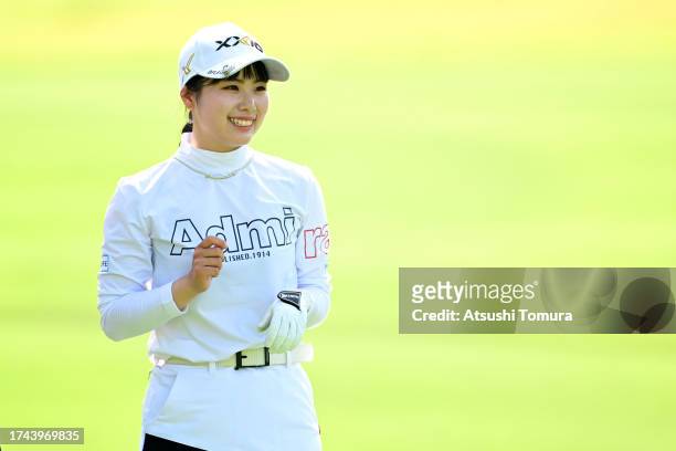 Amiyu Ozeki of Japan smiles on the 15th hole during the first round of NOBUTA Group Masters GC Ladies at Masters Golf Club on October 19, 2023 in...