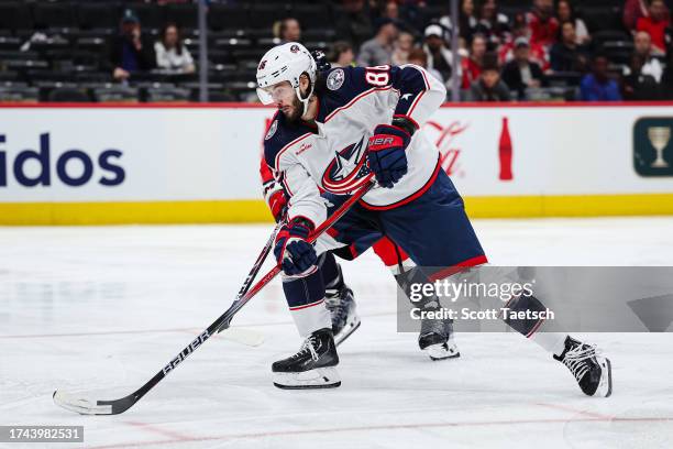 Kirill Marchenko of the Columbus Blue Jackets skates with the puck against the Washington Capitals defends during the third period of the NHL...