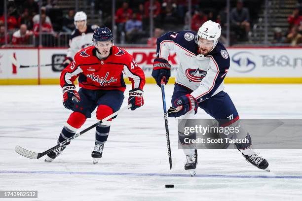 Sean Kuraly of the Columbus Blue Jackets skates with the puck against the Washington Capitals during the third period of the NHL preseason game at...
