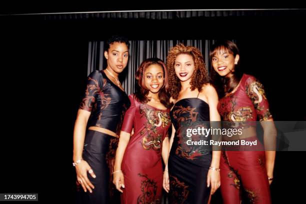 Singers Kelly Rowland, LaTavia Roberson, Beyoncé Knowles and LeToya Luckett of Destiny's Child poses for photos after their performance at Dennis...
