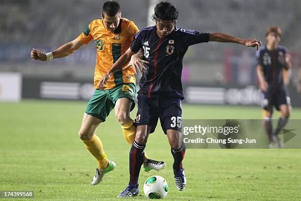 Tomi Juric of Australia competes for the ball with Kazuhiko Chiba Asian Cup match between Japan and Australia at Hwaseong Stadium on July 25, 2013 in...