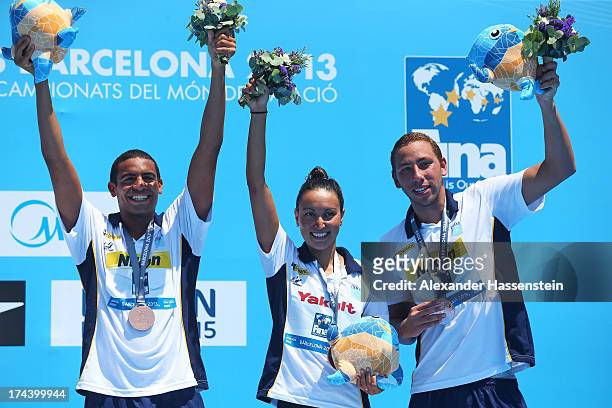 Alla Do Carmo, Samuel De Bona and Poliana Okimoto Cintra of Brazil, Broze medalists, celebrate after the Open Water Swimming Team 5k race on day six...