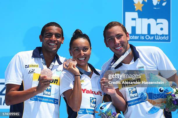 Alla Do Carmo, Samuel De Bona and Poliana Okimoto Cintra of Brazil, Broze medalists, celebrate after the Open Water Swimming Team 5k race on day six...