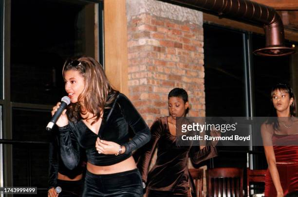 Singers Beyoncé Knowles, Kelly Rowland and LeToya Luckett of Destiny's Child performs at The Shark Bar in Chicago, Illinois in October 1997.
