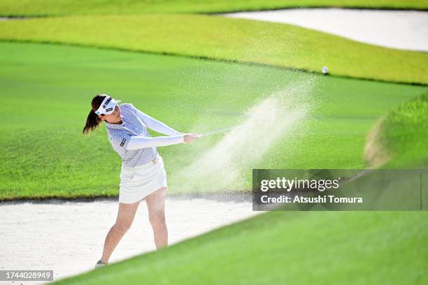 Mami Fukuda of Japan hits out from a bunker on the 8th hole during the first round of NOBUTA Group Masters GC Ladies at Masters Golf Club on October...