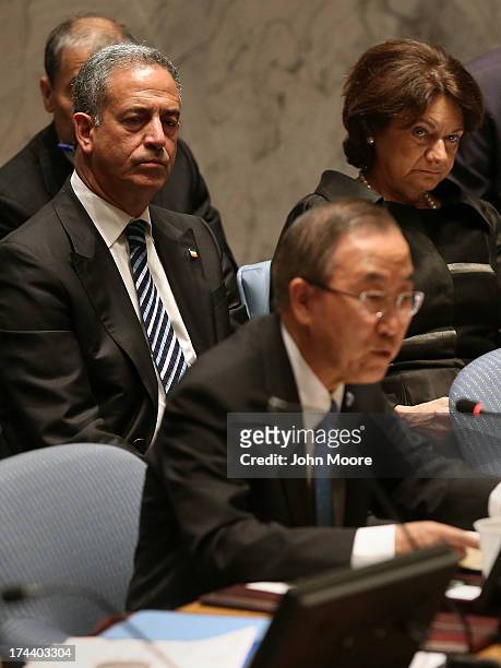 Former U.S. Senator Russ Feingold listens as UN Secretary General Ban Ki-moon speaks at a meeting of the UN Security Council on July 25, 2013 in New...