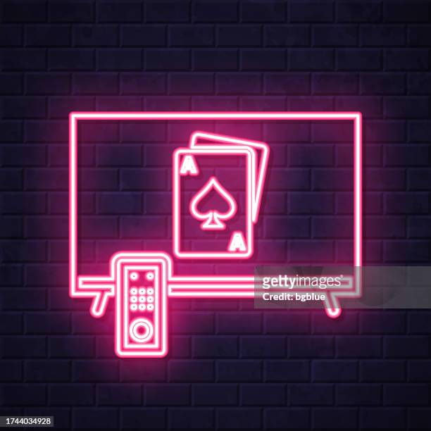 tv with playing card. glowing neon icon on brick wall background - blackjack stock illustrations