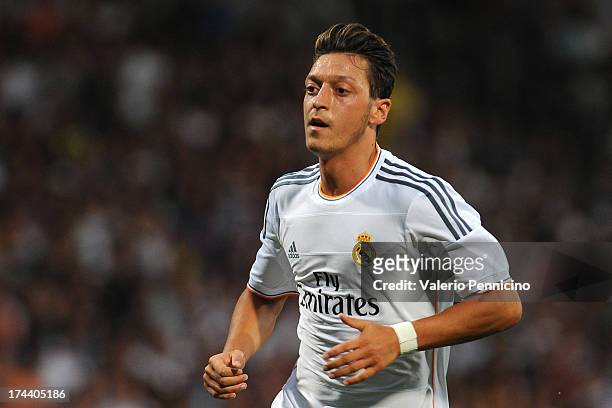 Mesut Ozil of Real Madrid looks on during the Pre Season match between Olympique Lyonnais and Real Madrid at Gerland Stadium on July 24, 2013 in...