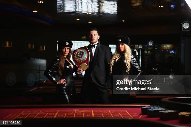 Nathan Cleverly the WBO World Light-Heavyweight title poses alongside two Russian deadly agents to promote his forthcoming fight against Sergey...