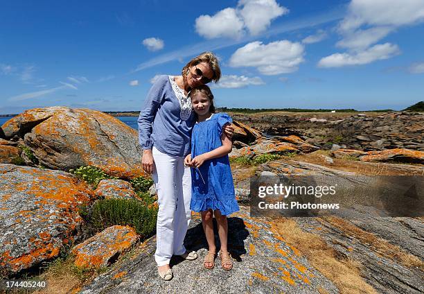 Queen Mathilde of Belgium and Princess Elizabeth of Belgium pose during their holiday on l'Ile d'Yeu on July 24, 2013 in Yeu, France.