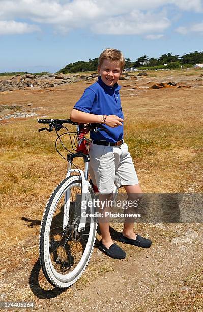 Prince Gabriel of Belgium poses next to his bike during their holiday on l'Ile d'Yeu on July 24, 2013 in Yeu, France.