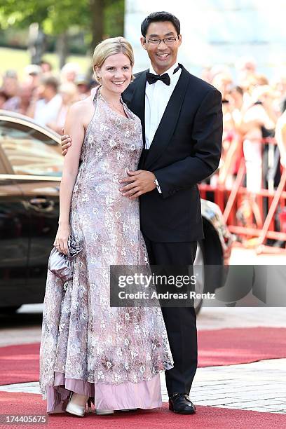 Philipp Roesler, Vice Chancellor and Chairman of the German Free Democrats and his wife Wiebke attend Bayreuth Festival Opening 2013 on July 25, 2013...