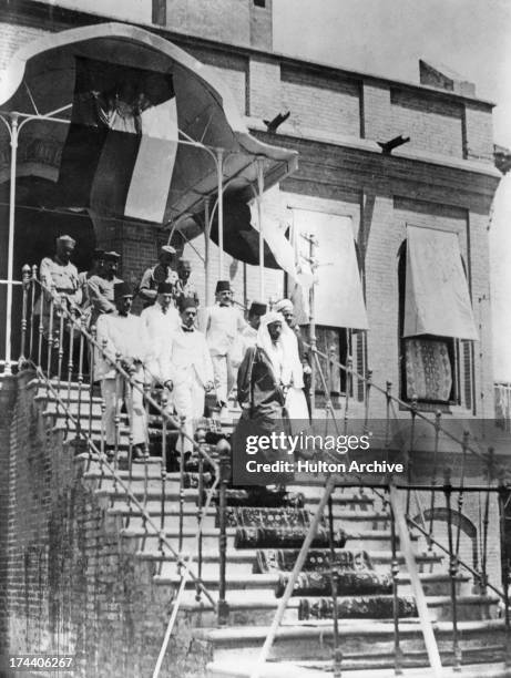 King Faisal I of Iraq seen leaving a building in Baghdad, Iraq, April 1921.