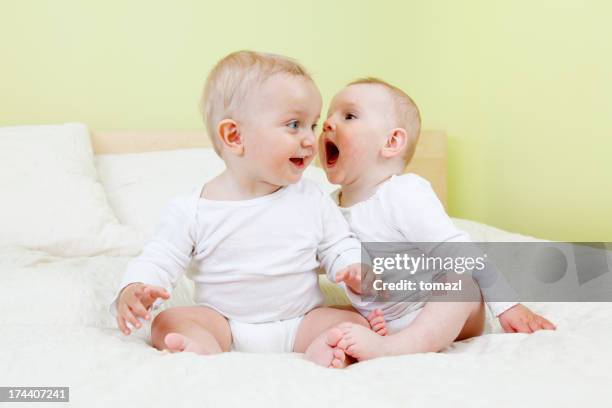 baby shouting to her friend - babies only stock pictures, royalty-free photos & images