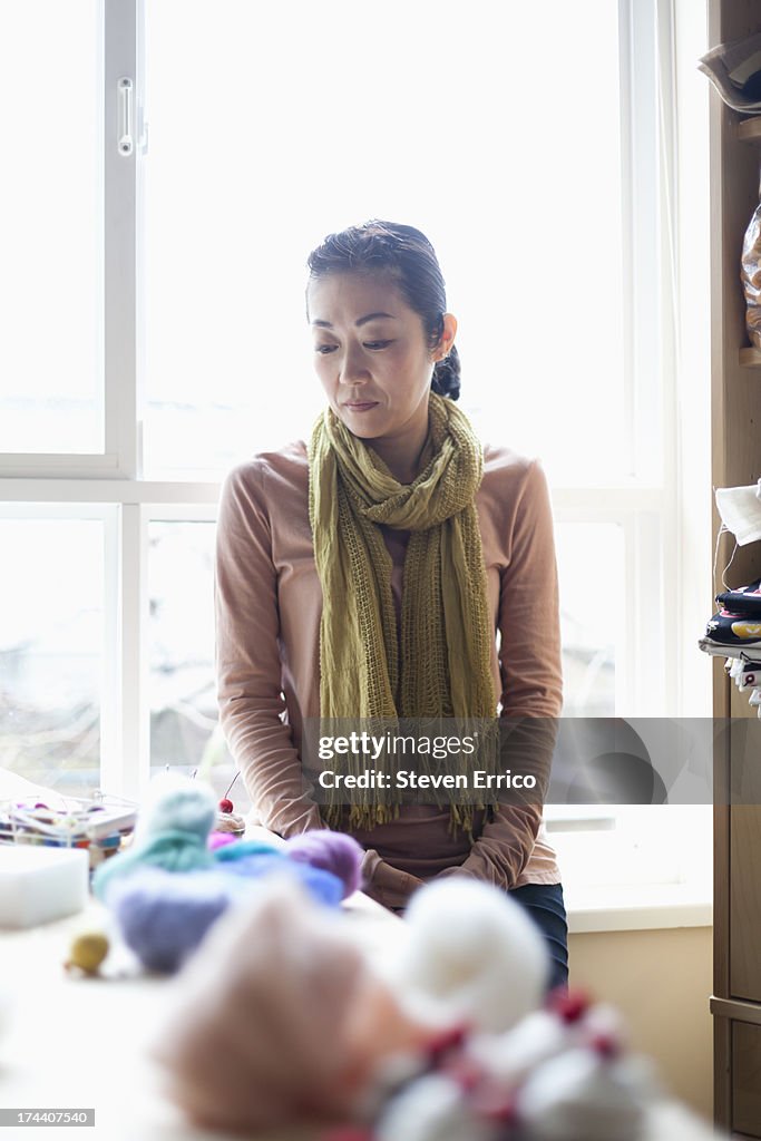 Woman relaxing in her artist studio