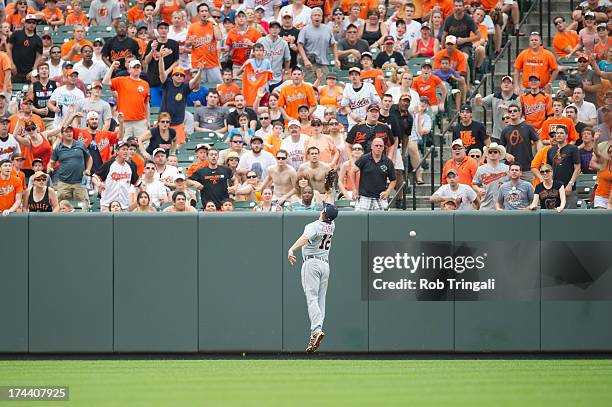 Andy Dirks of the Detroit Tigers attempts to catch a ball during the game against the Baltimore Orioles at Oriole Park at Camden Yards on June 2,...