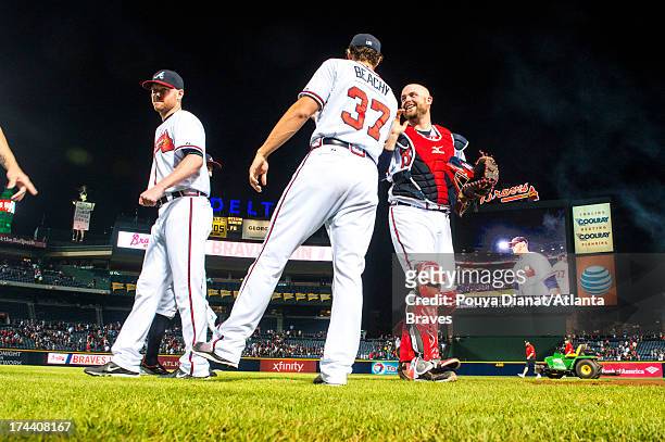 Brandon Beachy and Brian McCann of the Atlanta Braves celebrate after the game against the New York Mets at Turner Field on June 19, 2013 in Atlanta,...