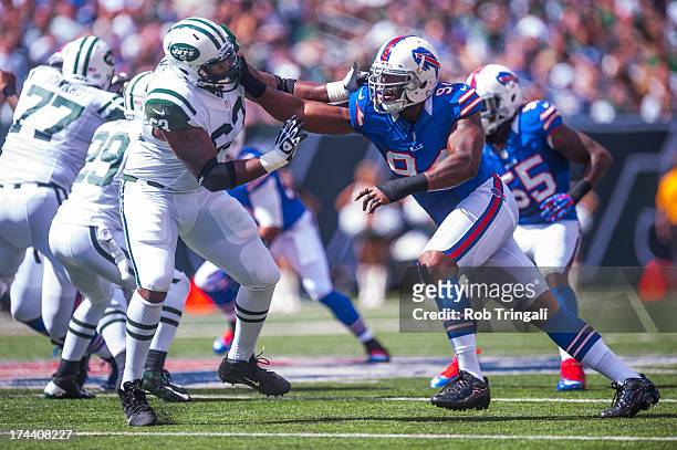 Defensive end Mario Williams of the Buffalo Bills defends his position against tackle Jason Smith of the New York Jets during the game between the...