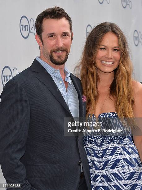 Actors Noah Wyle and Moon Bloodgood arrive to TNT's 25th Anniversary Party at The Beverly Hilton Hotel on July 24, 2013 in Beverly Hills, California.