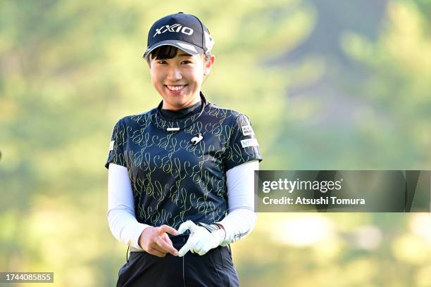 Nana Suganuma of Japan poses on the 17th green during the first round of NOBUTA Group Masters GC Ladies at Masters Golf Club on October 19, 2023 in...