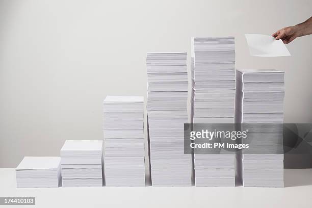 one more sheet of paper - paper stack stock pictures, royalty-free photos & images