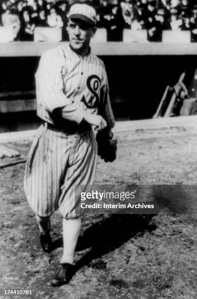 Pitcher Ed Cicotte, of the Chicago White Sox, warms up by throwing on the sidelines, Chicago, Illinois, 1918.
