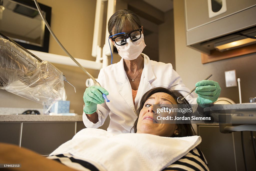 A female at a dentist appointment.