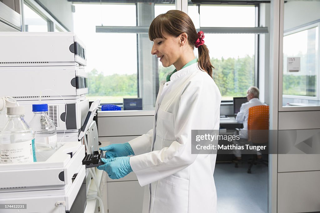 Engineering Or Lab Assistant Lab Assistant Working On A Technical Device High-Res Stock Photo ...
