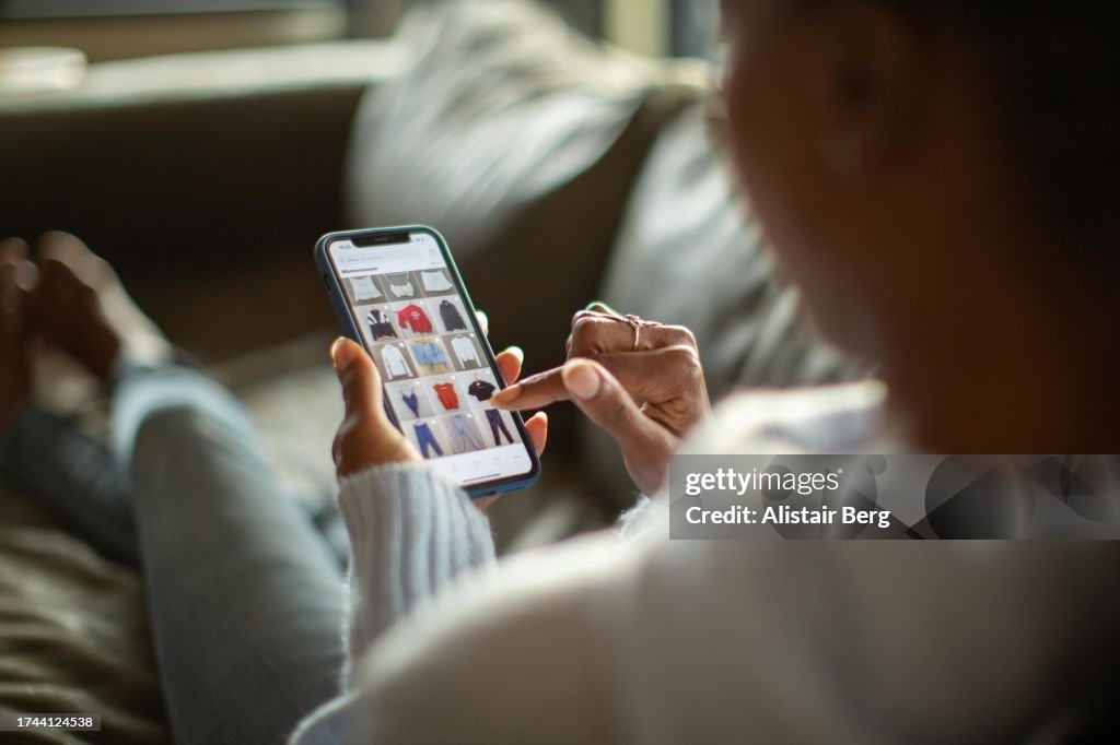 Woman purchasing clothes on a mobile app