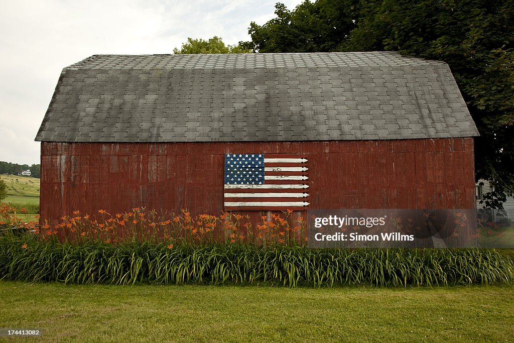 American Flag Painted on Red Barn