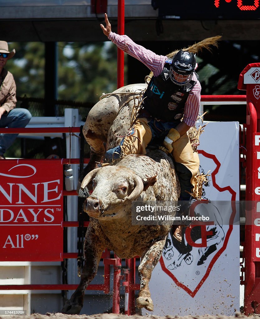 Bull rider Scotty Knapp is seen riding the bull Tatum Balcaen before ...