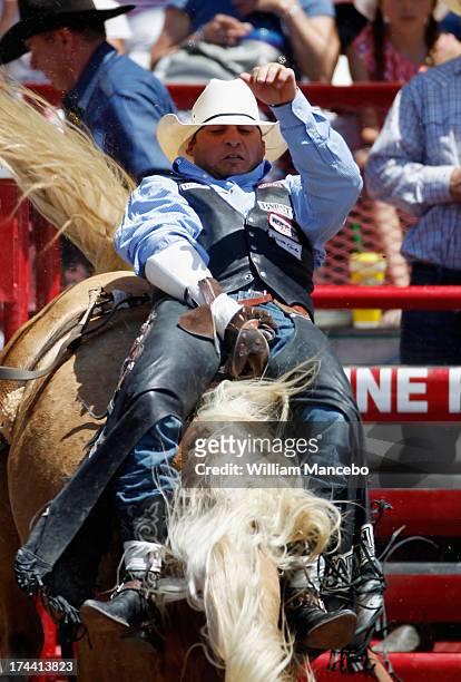 Bareback rider Jessy Davis is seen riding Just Peachy at the 117th annual Frontier Days rodeo and western celebration on July 23, 2013 in Cheyenne,...