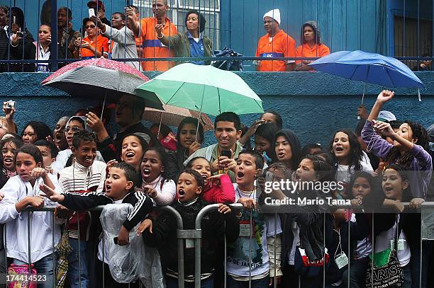 Children cheer as Pope Francis tours the Varghina favela, or shantytown, on July 25, 2013 in Rio de Janeiro, Brazil. More than 1.5 million pilgrims...