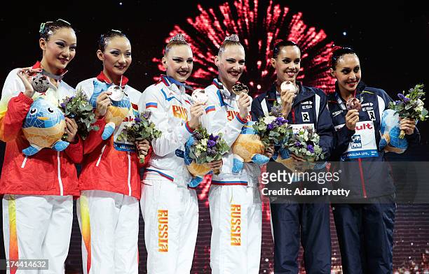 Silver medal winners Jiang Tingting and Jiang Wenwen of China , Gold medal winners Svetlana Kolesnichenko and Svetlana Romashina of Russia , and...