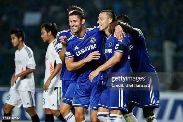 John Terry of Chelsea celebrates his goal with Gary Cahill during the match between Chelsea and Indonesia All-Stars at Gelora Bung Karno Stadium on...