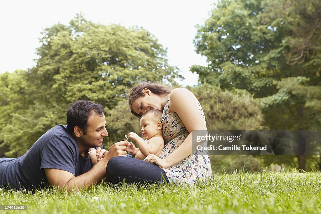 Couple and baby son sharing time in park