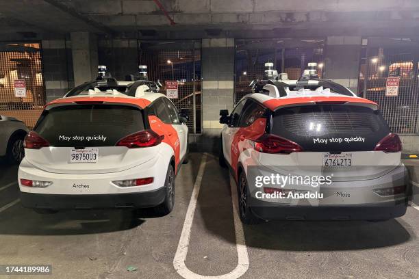Cruise' driverless robot taxis are seen at a parking lot as California Department of Motor Vehicles revokes its self-driving car permit and citing...