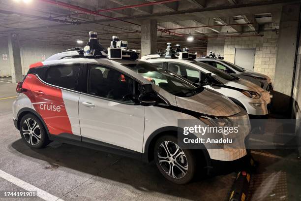 Cruise' driverless robot taxis are seen at a parking lot as California Department of Motor Vehicles revokes its self-driving car permit and citing...