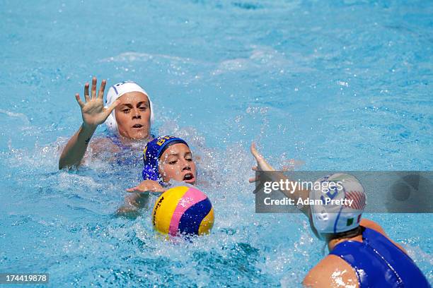 Aleksandra Cotti of Italy and Melani Dias of Brazil vie for poasession during the Women's Water Polo first preliminary round match between Italy and...