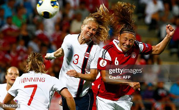 Norway's Marit Christensen and Denmark's Mariann Knudsen vie for the ball during the UEFA Women's European Championship Euro 2013 semi final football...