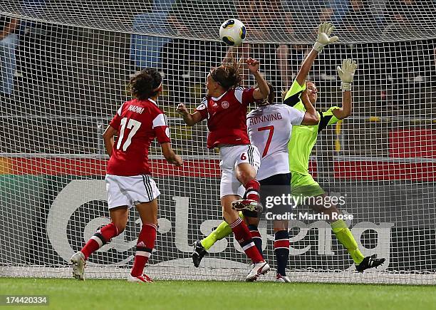 Marianne Knudsen of Denmark heads her team's equalizing goal during the UEFA Women's Euro 2013 semi final match between Norway and Denmark at Nya...